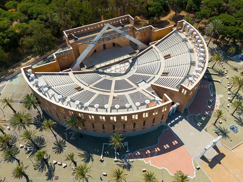 An auditorium surrounded by trees and palm trees, showing ancient Roman architecture with large seating steps, aerial view, Foro Iberoamericano de La Rabida, Iberoamerican Forum, Auditorium, Rabida, Rabida, municipality of Palos de la Frontera, Huelva, Andalusia, Spain, Europe
