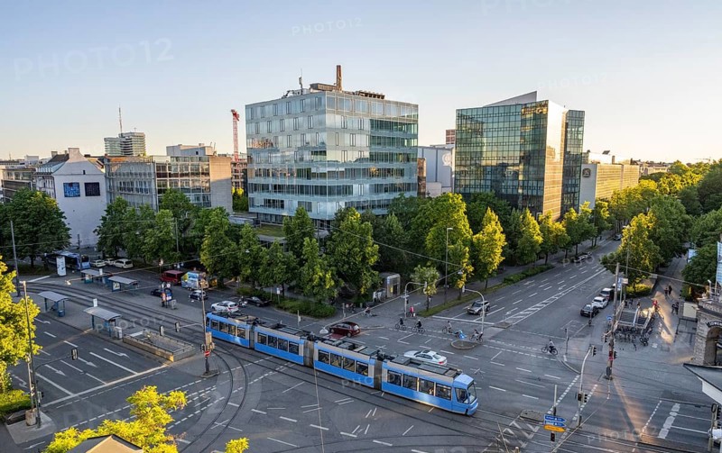 View from above of the crossroads at Stiglmaierplatz with tram, modern office buildings in the evening light, Löwenbräu brewery building, Stiglmaierplatz, Munich, Upper Bavaria, Bavaria, Germany, Europe