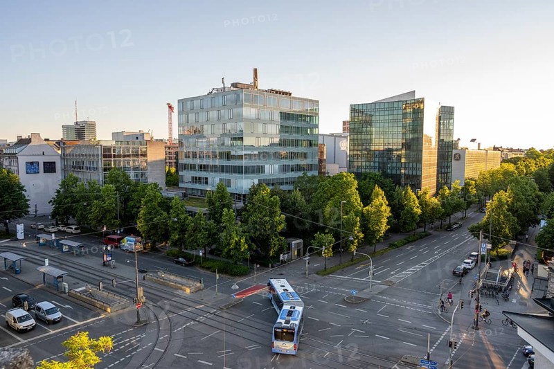 View from above of the crossroads at Stiglmaierplatz with public bus, modern office buildings in the evening light, Löwenbräu brewery building, Stiglmaierplatz, Munich, Upper Bavaria, Bavaria, Germany, Europe