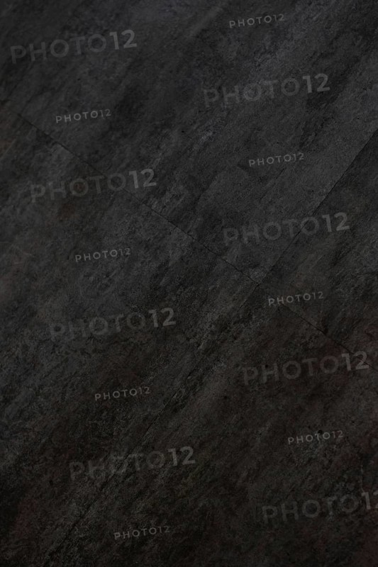 Vertical image of the texture of a dark gray and black tile, AI generated