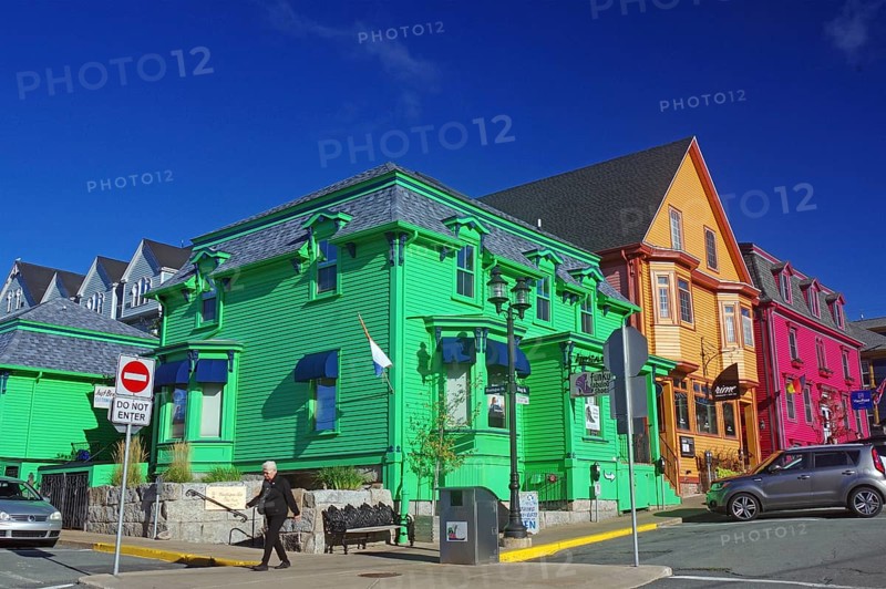 Colourful historic buildings on a city street under a clear blue sky, Lunenburg, Nova Scotia, Canada, North America