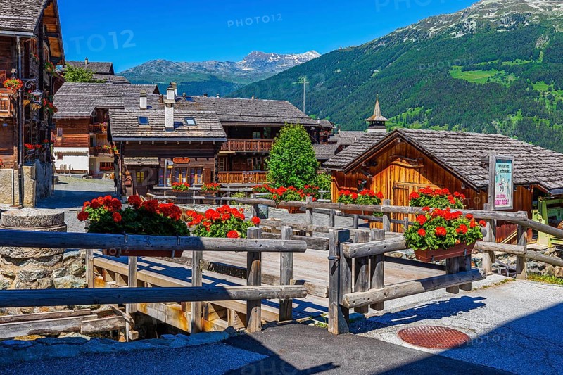 Old wooden houses with wooden shingle roofs and flower boxes in the historic centre of Grimentz, Val d'Anniviers, Valais Alps, Canton Valais, Switzerland, Europe