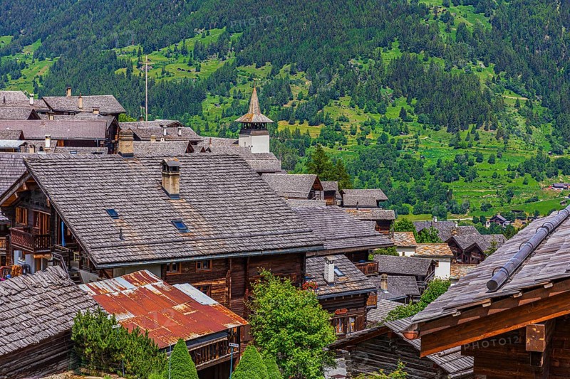 Old houses with wooden shingle roofs, Saint Theodule church at the back, historic village centre, Grimentz, Val d'Anniviers, Valais Alps, Canton Valais, Switzerland, Europe