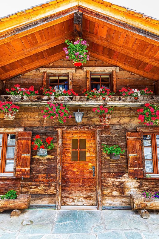 Old wooden house with floral decorations, historic village centre, Grimentz, Val d'Anniviers, Valais Alps, Canton Valais, Switzerland, Europe