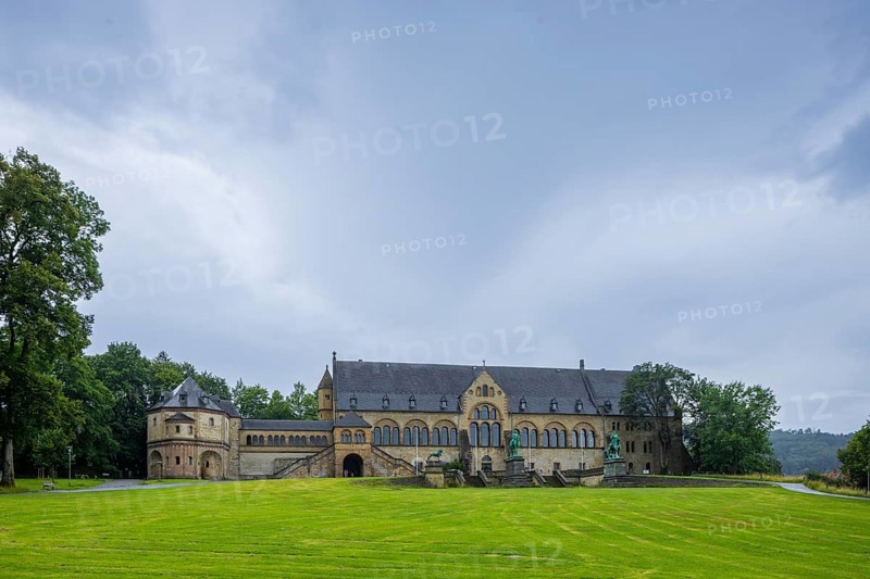 The imperial palace of Goslar covers an area of around 340 by 180 metres, situated at the foot of the Rammelsberg in the south of the town of Goslar, on which the imperial house, the former collegiate monastery St. Simon and Judas, the palace chapel of St. Ulrich and the Church of Our Lady are or were located. The imperial palace, built between 1040 and 1050 under Henry III, is a unique monument to secular architecture. For over 200 years, German and European history was written here at numerous imperial and court conventions. Copies of the Brunswick Lion and equestrian monuments in front of the imperial palace, Kaiserpfalz Goslar, Goslar, Lower Saxony, Germany, Europe