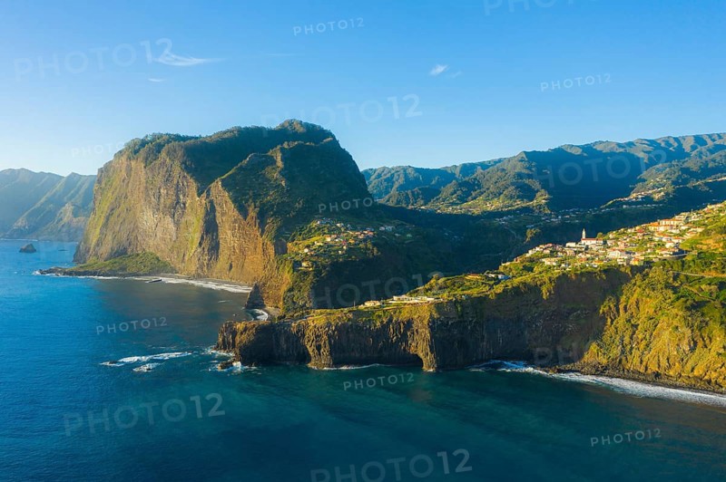 Penha d'Aguia Mountain, Faial Town and Atlantic Ocean in the Morning. Aerial View. Madeira, Portugal, Europe