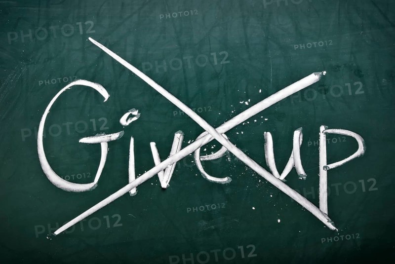 Do not give up, words on blackboard