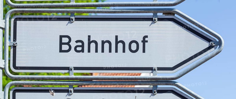 Road sign Signpost to railway station, Germany, Europe