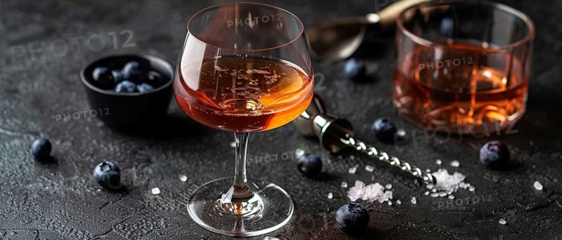 Elegant cocktail glass with a sophisticated drink and blueberries on a dark moody background, AI generated