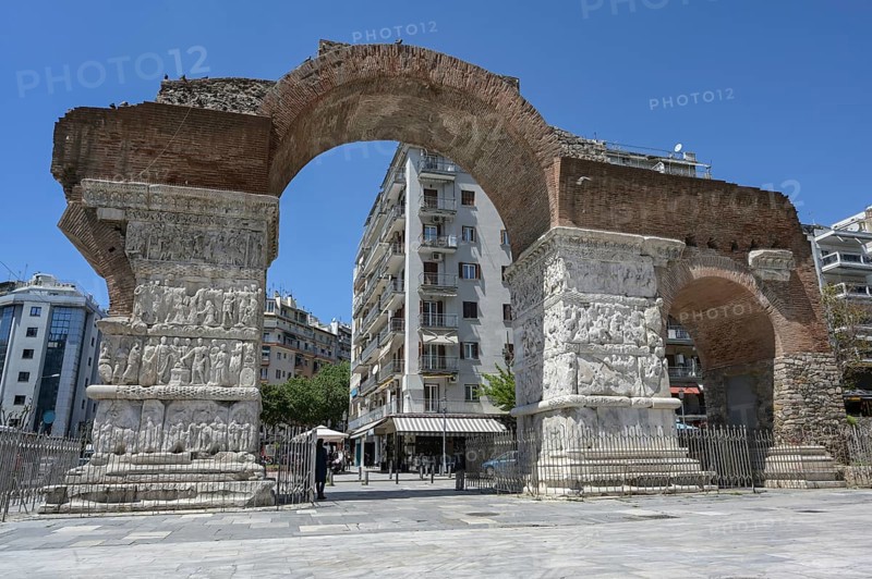 Arch of Galerius in Thessaloniki city center, famous historic monument, early Byzantine architecture and art with sculptural relief decoration on the marble pillars showing battles and triumph, Greece, Europe