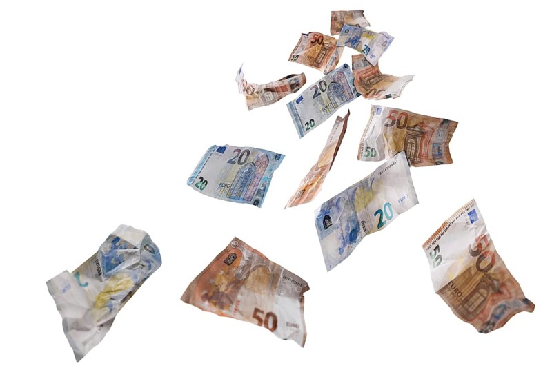 Fifty and twenty paper banknotes in euro currency flying down, money concept for lucky finance, business success, investment or lottery win, isolated on a white background, selected focus