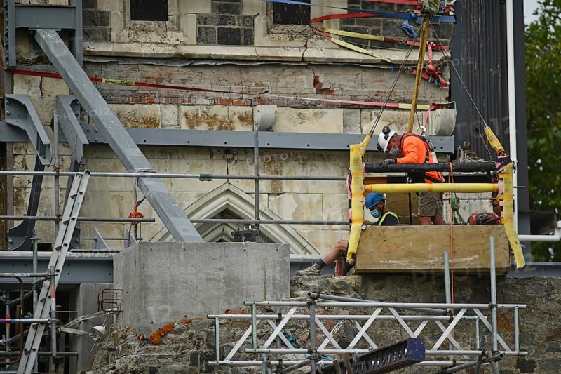 CHRISTCHURCH, NEW ZEALAND, FEBRUARY 24, 2022: A team of tradesmen work on the Anglican Cathedral during the Christchurch rebuild, 11 years after the city was devastated by an earthquake
