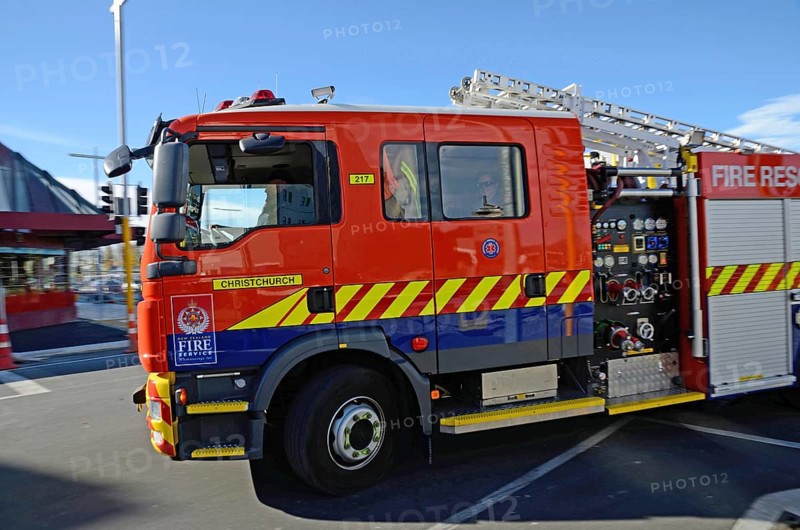 CHRISTCHURCH, NEW ZEALAND, APRIL 20, 2018: A fire rescue truck rushes to its next job in the central business district. Slight blur in background from panning