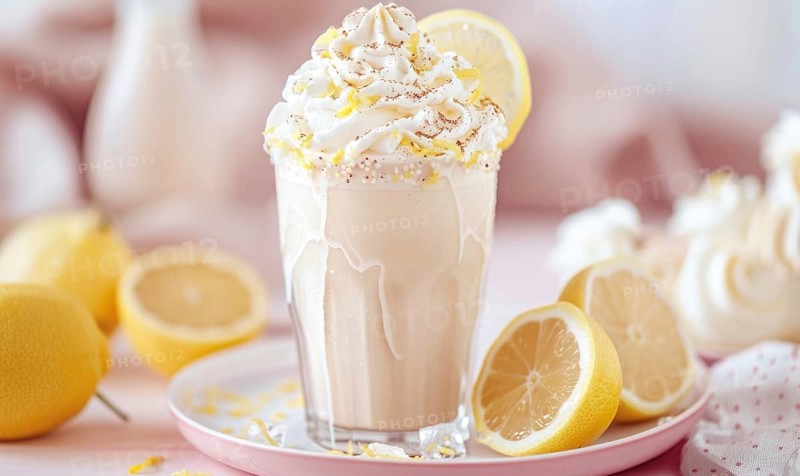 Lemon and coffee milkshake with whipped cream on a pastel pink plate AI generated