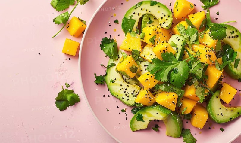 Avocado and mango salad with cilantro on a pastel pink plate AI generated