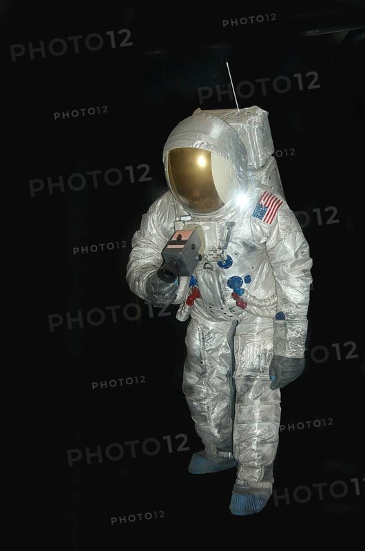 American astronaut in pressure space suit on black background