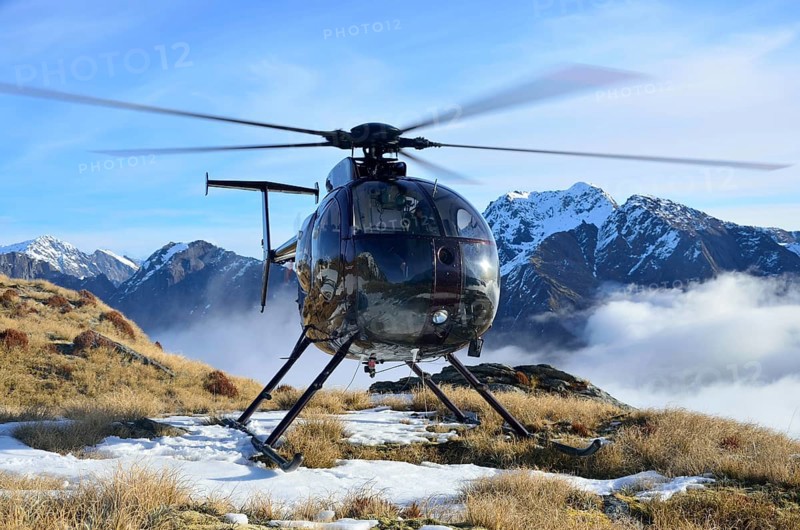 Helicopter waiting for hunters in South Westland's Southern Alps, New Zealand, Oceania