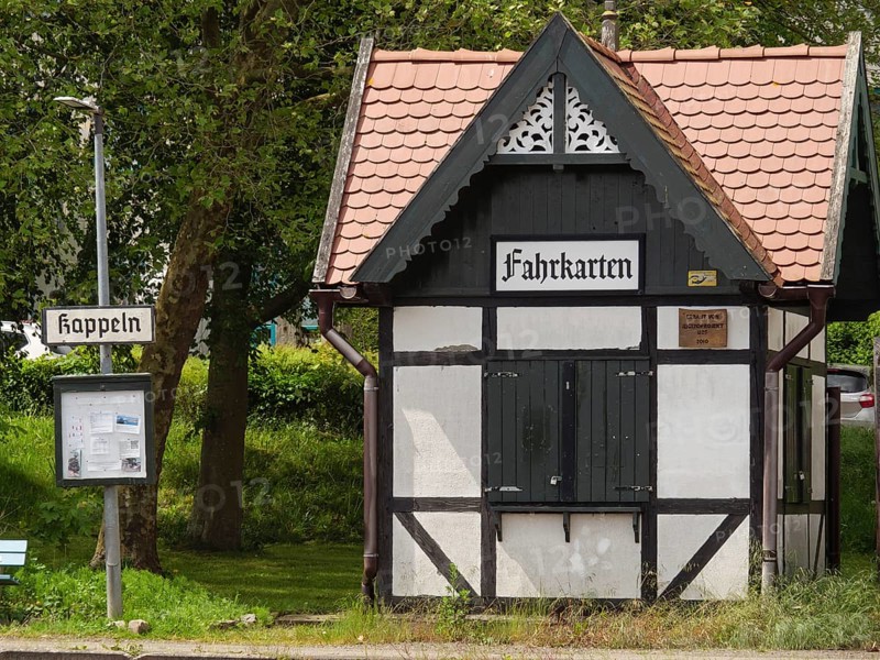 Small half-timbered building with signs and ticket office at an old railway station, Kappeln, Schleswig-Holstein, Germany, Europe