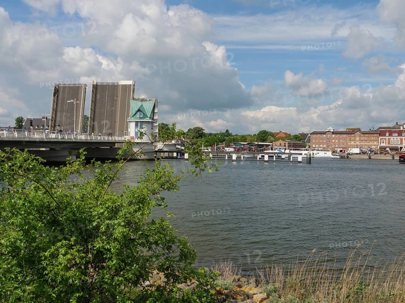 Open bridge over water in city scenery with clouds, Kappeln, SChleswig-Holstein, Germany, Europe