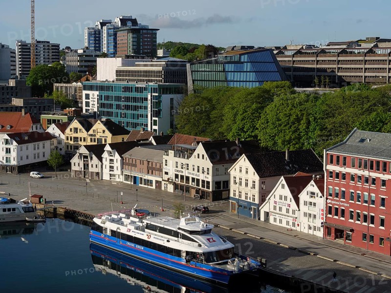 A cityscape with a harbour, modern buildings and boats under a clear sky, Stavanger, Norway, Europe
