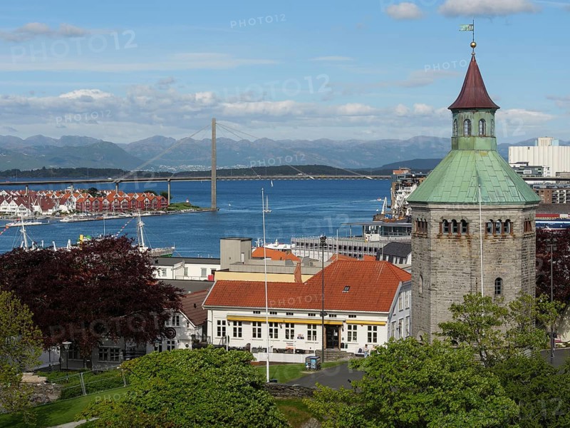 City view with church tower in the foreground, a bridge in the background and the sea, Stavanger, Norway, Europe