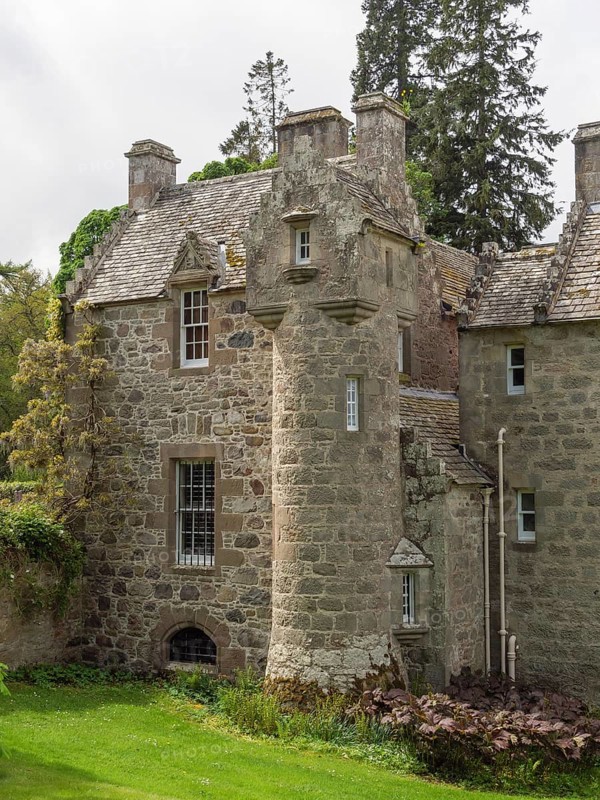 Part of an old castle with towers and stone walls, surrounded by trees, inverness, Scotland, Great Britain