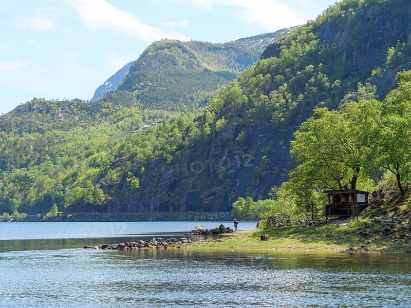 A small cabin on the shore of a clear lake, surrounded by mountains and dense forest, quiet and idyllic, Eidfjörd, Norway, Europe