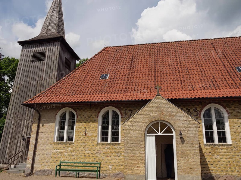 Small brick church with wooden tower and red tiled roof in summer, Kappeln, Schleswig-Holstein, Germany, Europe