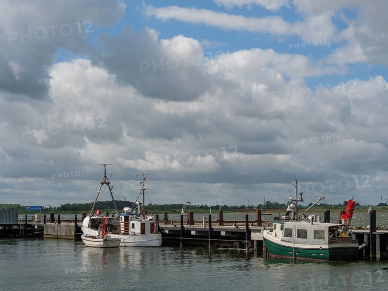 Two boats at a jetty under a partly cloudy sky, Maasholm, Schleswig-Holstein, Germany, Europe