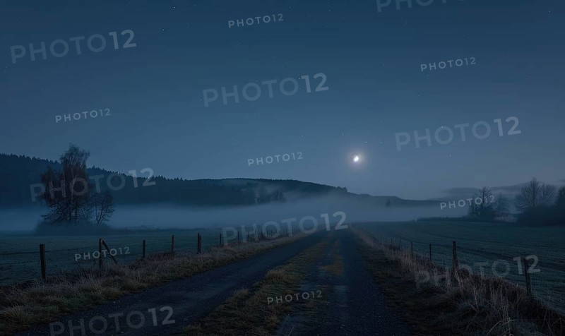 Night sky with low-lying fog and a sliver of moonlight AI generated