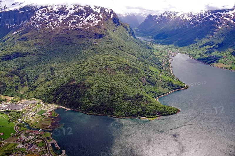 Breathtaking panorama of a fjord with snow-capped mountains and dense forests, view from Hoven, Nordjord, Loen, Fjordland, Norway, Europe