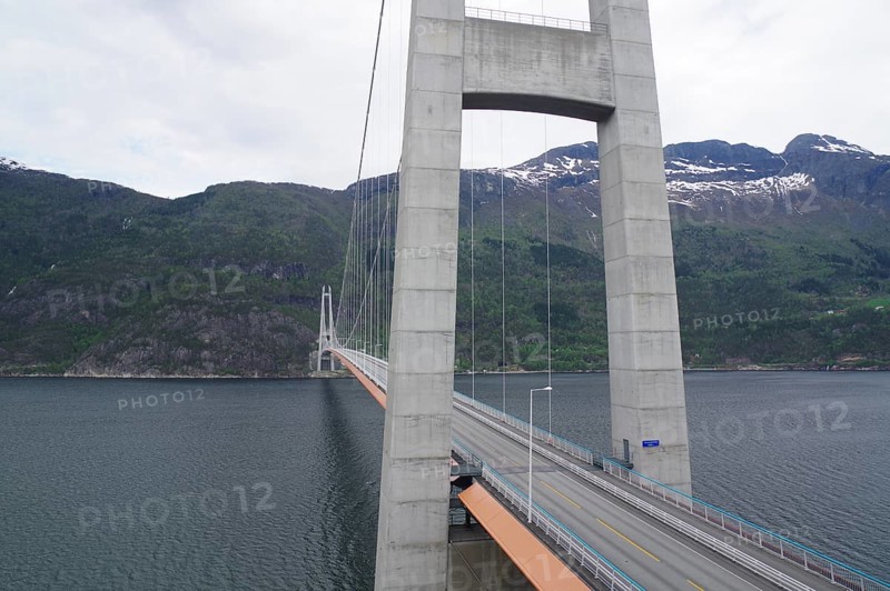 Large bridge over a fjord with mountains in the background under a cloudy sky, Hardanger, Hardangerfjord, Norway, Europe