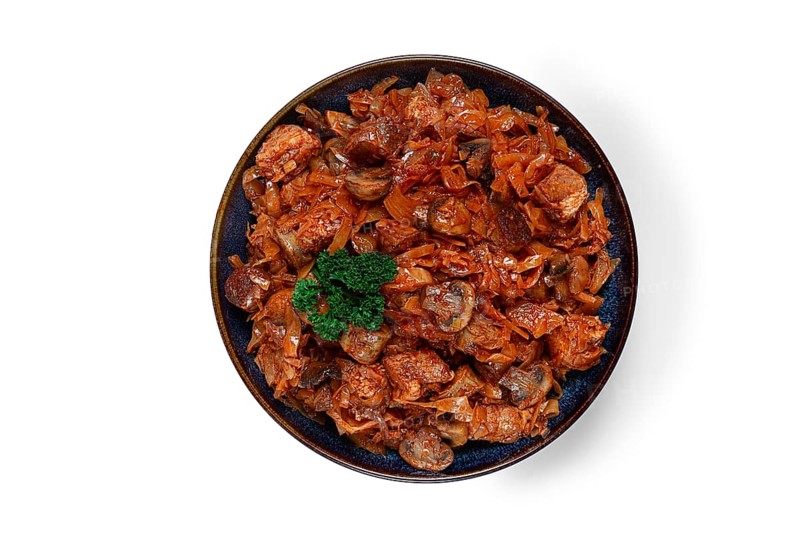 Bigos, bigus is a national Polish dish, made of cabbage and meat, stewed, on a white background, isolate, homemade, no people