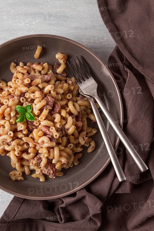 Pasta with stewed meat, pasta in the navy, horns, homemade, no people