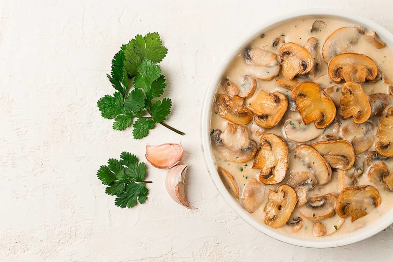 Mushrooms in creamy garlic sauce, with herbs and spices, gravy, sauce, no people
