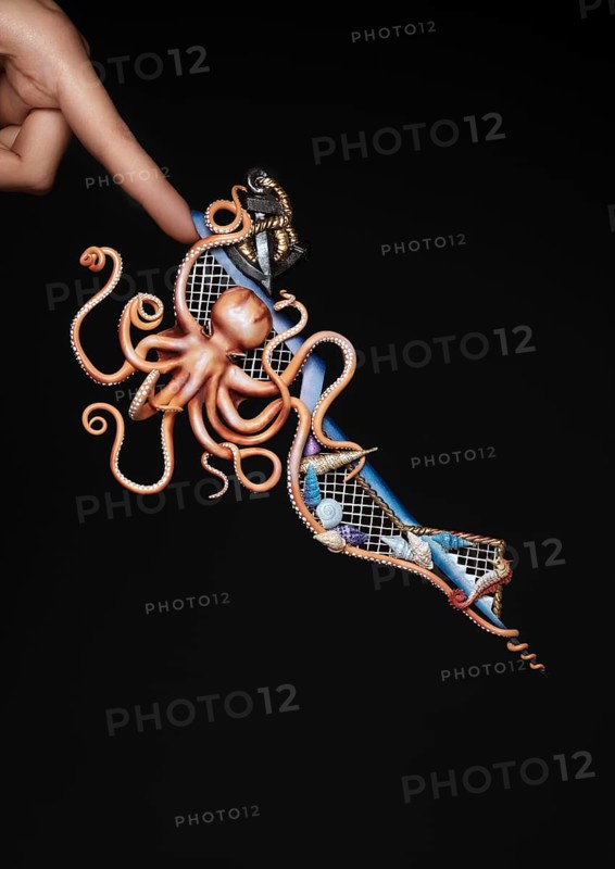 Creative design of nails on female hands. Art manicure. Photo taken in studio