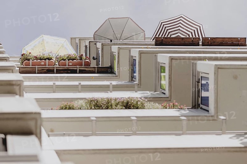 Parasols on the balcony of a prefabricated building, taken in Berlin, 07/08/2024