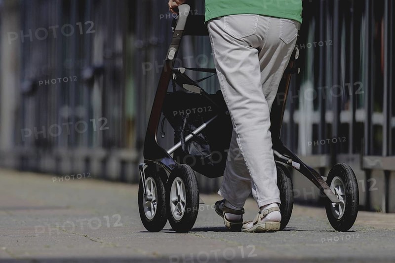 A woman with a rollator, photographed in Berlin, 07/08/2024