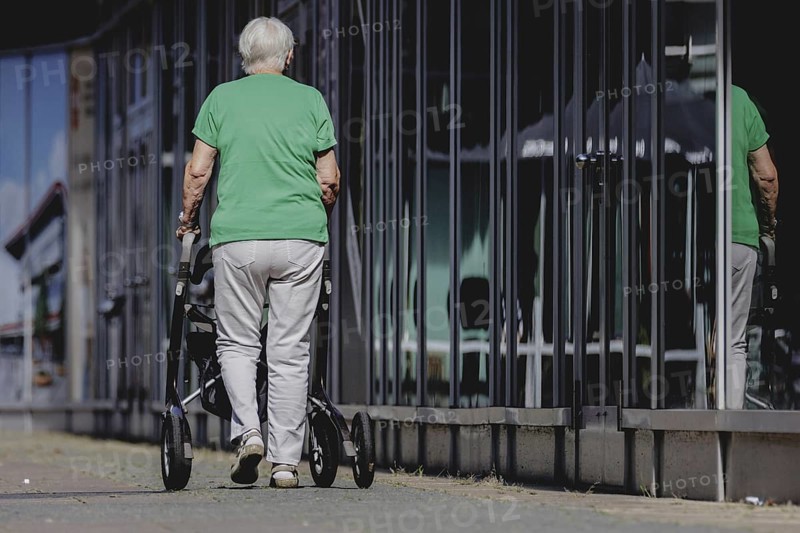 A woman with a rollator, photographed in Berlin, 07/08/2024