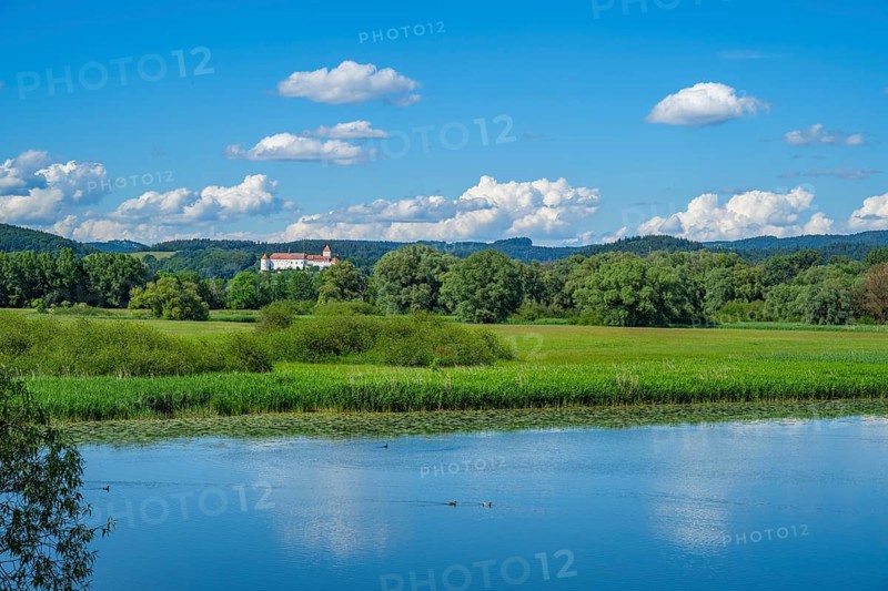 Landscape of Danubia river with reflection of the landscape and Clouds, Castle of Wörth an der Donau in the background, Upper Palatinate, Bavaria, Germany, Europe
