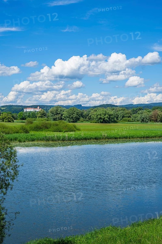Landscape of Danubia river with reflection of the landscape and Clouds, Castle of Wörth an der Donau in the background, Upper Palatinate, Bavaria, Germany, Europe