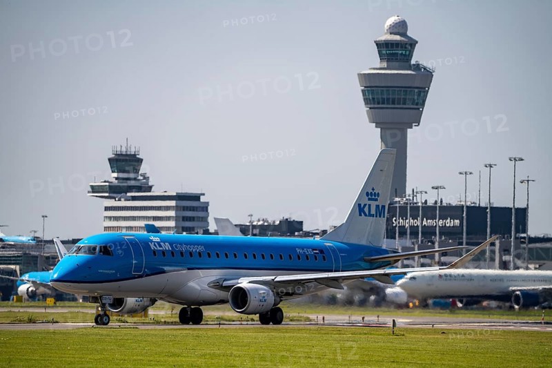 Aircraft at Amsterdam Schiphol Airport, on the taxiway for take-off on the Aalsmeerbaan, 18L/36R, air traffic control tower, terminal, Netherlands