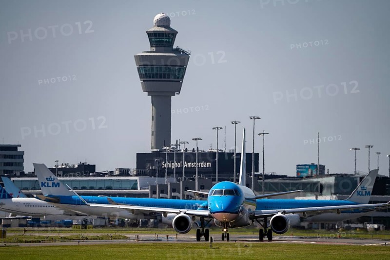 Aircraft at Amsterdam Schiphol Airport, on the taxiway for take-off on the Aalsmeerbaan, 18L/36R, air traffic control tower, terminal, Netherlands