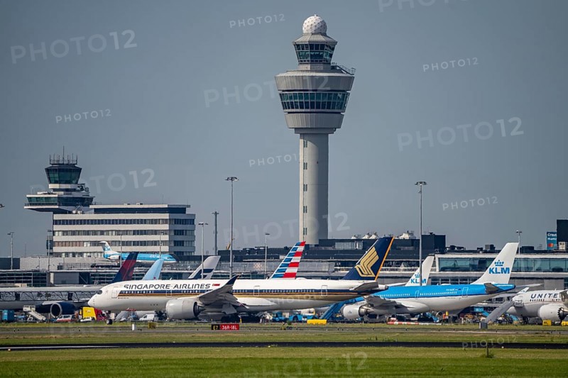 Aircraft at Amsterdam Schiphol Airport, taxiway, apron, air traffic control tower, terminal, Netherlands