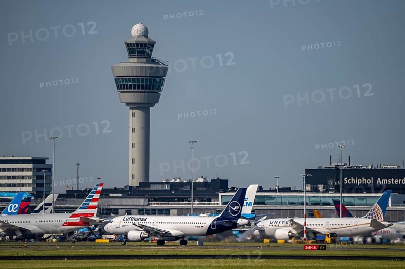 Aircraft at Amsterdam Schiphol Airport, taxiway, apron, air traffic control tower, terminal, Netherlands