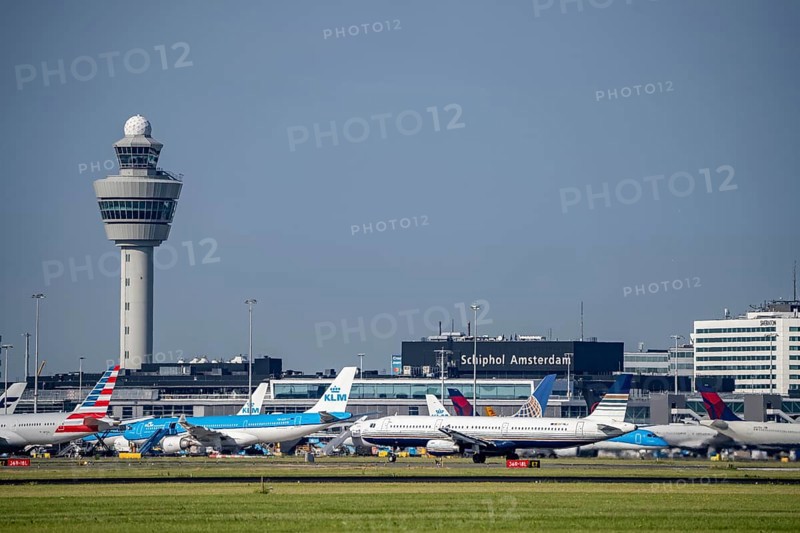Aircraft at Amsterdam Schiphol Airport, taxiway, apron, air traffic control tower, terminal, Netherlands