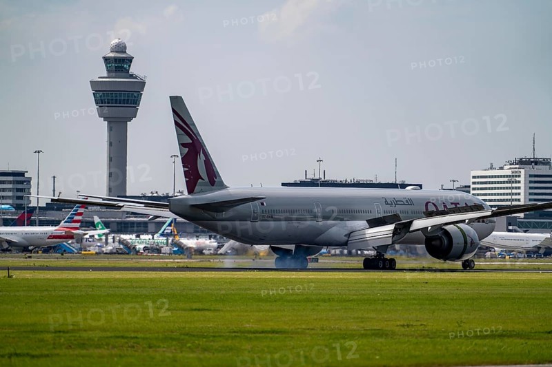 Qatar Airways Boeing 777-3DZ, aircraft landing at Amsterdam Schiphol Airport, Buitenveldertbaan, 09/27, Air Traffic Control Tower, Terminal, Netherlands