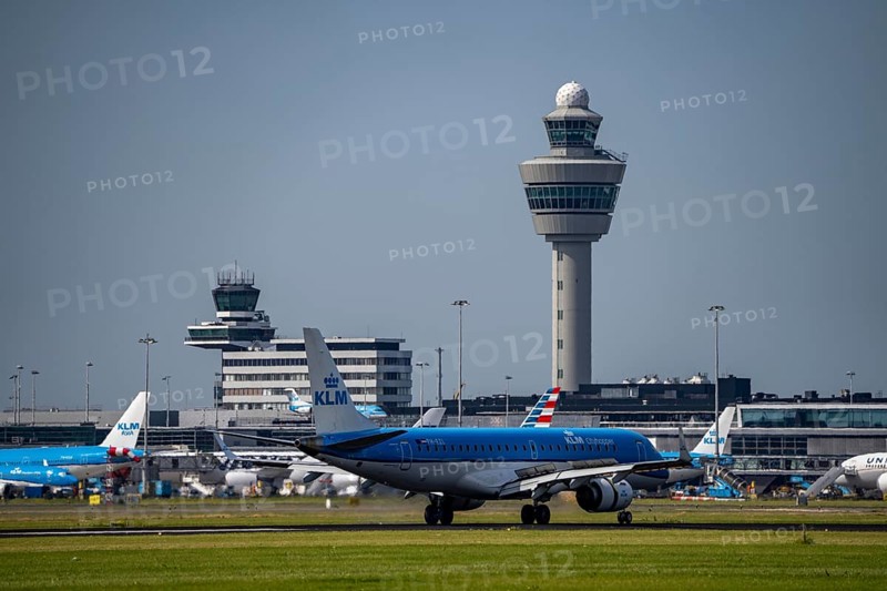 KLM Embraer E190STD aircraft landing at Amsterdam Schiphol Airport, Buitenveldertbaan, 09/27, Air Traffic Control Tower, Terminal, Netherlands