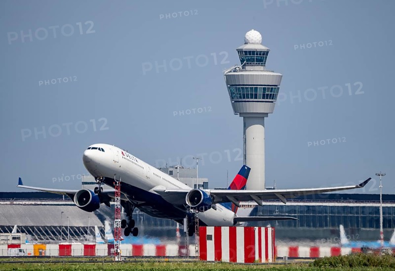 Delta Airlines aircraft taking off at Amsterdam Schiphol Airport, Kaagbaan, 06/24, air traffic control tower, terminal, Netherlands