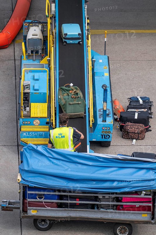 Amsterdam Schiphol Airport, loading baggage onto a plane, Boeing 737, Netherlands